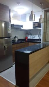 Een keuken of kitchenette bij Bonito departamento VIP estreno en Condominio