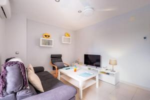 a living room with a couch and a table at 2 Bed apartment near the beach with pool in El Campello