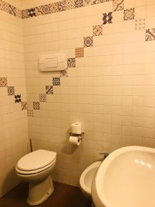 a bathroom with a toilet and a sink at Agriturismo La Montina in Ponti Sul Mincio +48 photos