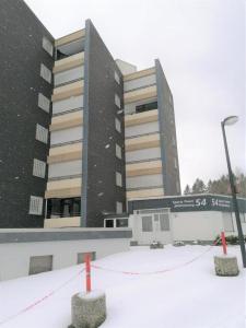a building with a lot of snow in front of it at Ferienwohnung Eagle Nest in Winterberg in Winterberg