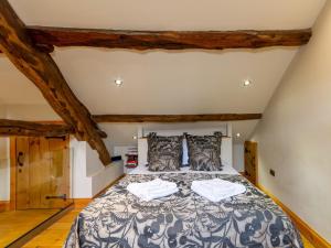 a bedroom with a bed in a attic at 1 Bed in Hawkshead Village LLH18 in Hawkshead