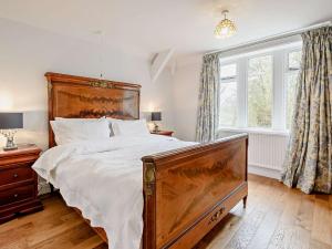 a bedroom with a large bed and a large window at 2 Bed in Glossop 52409 in Glossop