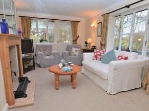 a living room with a white couch and a coffee table at 2 Bed in Sherborne 53673 in Chetnole