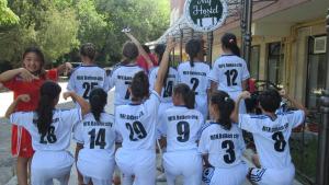 a girls soccer team is posing for a picture at MY HOSTEL in Bishkek