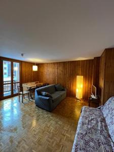 a living room with a couch and a table at Baby in Gressoney-la-Trinité