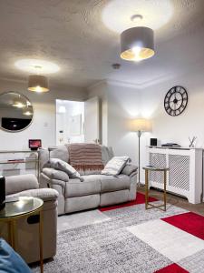 a living room with a couch and a table at Immaculate 2-Bed Apartment in Rochester in Rochester