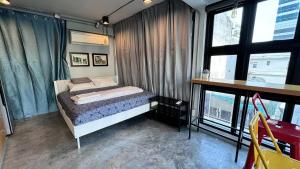 Postel nebo postele na pokoji v ubytování The Chatbox Silom Hostel