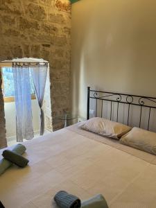 Postel nebo postele na pokoji v ubytování Intra Moenia