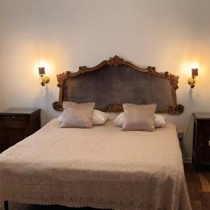 a bedroom with a large bed with white sheets and pillows at Iasskii Torg - La belle epoque in Iaşi +68 photos