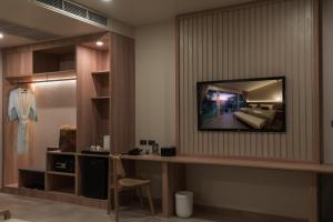 a dressing room with a mirror and a dressing table at Niranapa Boutique Resort in Kata Beach