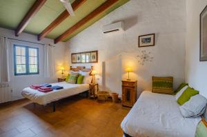 Ένα ή περισσότερα κρεβάτια σε δωμάτιο στο Casa Poupitta - 10 personnes - 5 chambres en suite - piscine