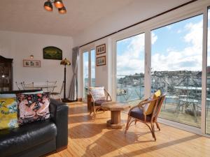 a living room with a couch and a table at 2 Bed in Brixham BX026 in Brixham