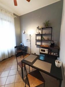 a dining room with a table and chairs at B&B Number 9 in Bologna