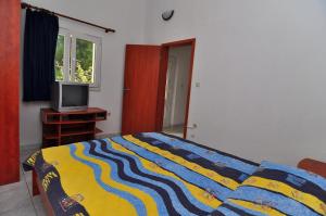 Łóżko lub łóżka w pokoju w obiekcie Apartments Livia