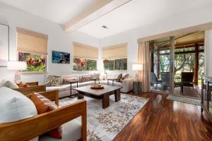 a living room with a couch and a table at Mauna Lani Fairways 302 in Waikoloa
