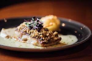 a plate with a piece of food on a table at Crowne Plaza - Belfast, an IHG Hotel in Belfast