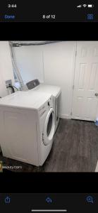 a white washing machine sitting in a room at NICE BEDROOM NEXT JOHNS HOPKIN UNIVERSITY in Baltimore