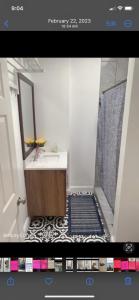 a picture of a bathroom with a sink and a mirror at NICE BEDROOM NEXT JOHNS HOPKIN UNIVERSITY in Baltimore