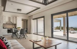 a living room with a couch and a table at Villa Anelle in Karavadhos