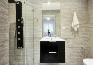 a bathroom with a sink and a shower at Luxury Villa in Kechria 2 in Kechria +52 photos