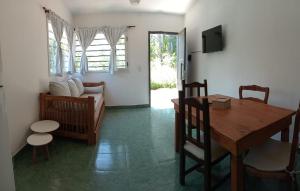 a living room with a table and a couch at El Cañaveral in Capilla del Monte