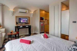 Postel nebo postele na pokoji v ubytování España Condo Resort Pattaya