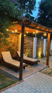 a gazebo with two beds under it at Pousada Maktub in Carolina