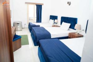 Postel nebo postele na pokoji v ubytování Fox Resort El Gouna + 26 fotografií