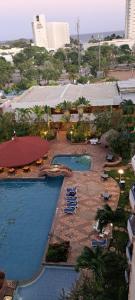 an overhead view of a resort with two swimming pools at Departamento Tipo Estudio Dynasty Isla de Margarita in Porlamar
