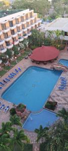 Vista de la piscina de Departamento Tipo Estudio Dynasty Isla de Margarita o alrededores