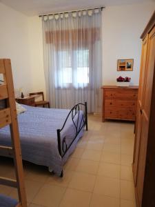 Ένα ή περισσότερα κρεβάτια σε δωμάτιο στο Casa Vacanza Angela