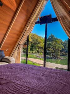Postel nebo postele na pokoji v ubytování RIO HOTEL Y GLAMPING