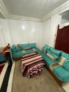 a living room with couches and a couch at Family house in the center of fez in Fez