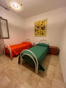 Postel nebo postele na pokoji v ubytování Casa Vacanze Perla di Mare