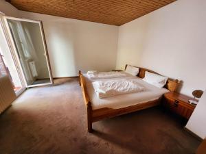 a bedroom with a bed and a large window at Dhh for fitters and craftsmen in Baden-Baden