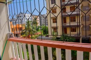 a balcony with a view of some buildings at NIKO HOMES in Mombasa