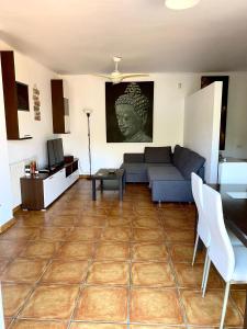 a living room with a couch and a table at FUENGIROLA Apartament POOL & PARKING in Fuengirola