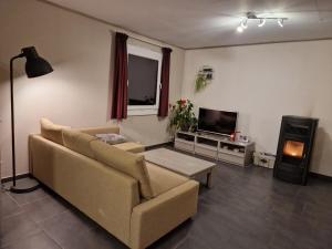 Posezení v ubytování Chambre au calme à Ramillies - chez Ben