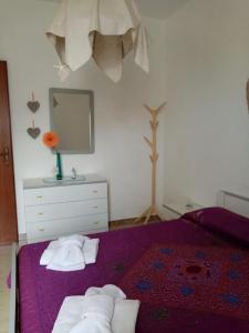 เตียงในห้องที่ Splendido appartamento a Lampedusa, con terrazzo !