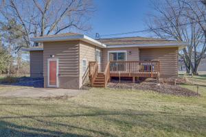 een klein huis met een veranda en een terras bij Chippewa Falls Vacation Rental 6 Mi to Eau Claire in Chippewa Falls