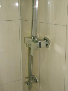 a shower with a faucet in a bathroom at Oren Hotel Maldives in Maamigili +40 photos