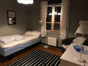 a small bedroom with a bed and a window at 8 bed house in Vik, Åre in Åre