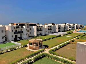an aerial view of an apartment complex with a gazebo at White on the sea in Ras Sedr