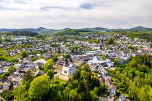 an aerial view of a small town in the mountains at Cozy City Apartment Daun - Ferienwohnung - EIFEL The Natural Home in Daun