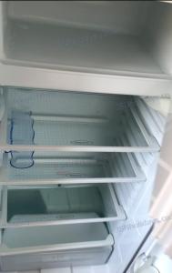 an empty refrigerator with its door open with its door open at JSNHolidays@CraigTara in Ayr