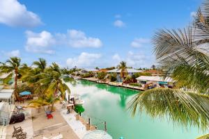 a view of a river with palm trees and houses at Breezy Palms in Key Colony Beach