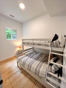 a bedroom with two bunk beds in a room at Nala's Lake House Retreat 