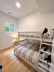 a bedroom with two bunk beds in a room at Nala's Lake House Retreat in Combermere