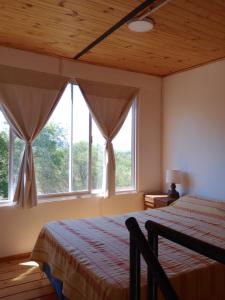 Postel nebo postele na pokoji v ubytování Cabañas Guayacán