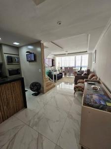 Et tv og/eller underholdning på Casa da Praia à 300 mts do Mar e Piscina Privativa + 51 billeder